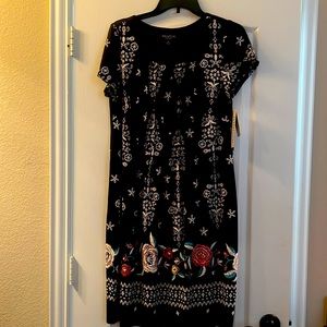 Black casual dress with beautiful stitched white and multicolored flowers.